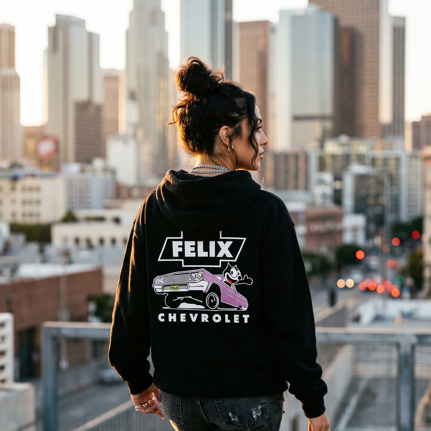 Model wearing ’64 Metal Flake Hoodie – Purple with lowrider inspired back graphic artwork